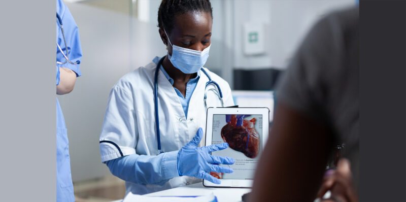 nt-proBNP: cardiologist showing heart image on tablet to patient